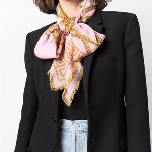 Versace Medusa head motif scarf in pink and gold.